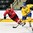 GRAND FORKS, NORTH DAKOTA - APRIL 18: Sweden's Adam Thilander #8 skates with the puck while Switzerland's Axel Simic #19 chases him down during preliminary round action at the 2016 IIHF Ice Hockey U18 World Championship. (Photo by Minas Panagiotakis/HHOF-IIHF Images)

